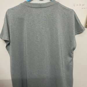 shimmery light sea green top with capped sleeves