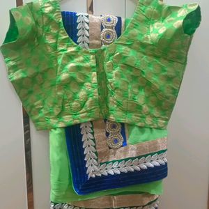 A Green Saree With Blue Border