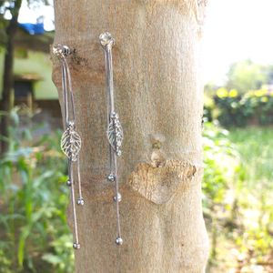 silver earrings with white stone .