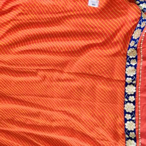 orange leheriya saree with velvet border