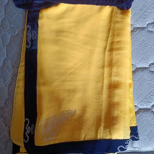 Shining Yellow Saree With Navy Blue Blouse