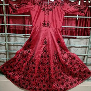 gown , red base with black embroidery