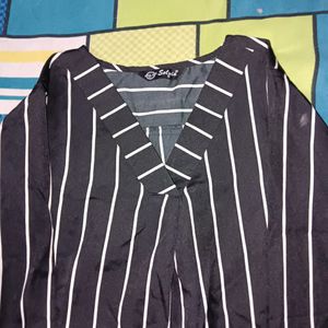 A White  Lined Top Over. Black Shirt