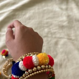 golden bracelets with pompom