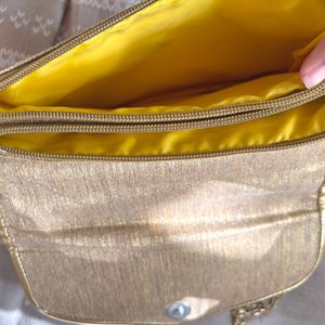 A Embroidered Sling Bag Golden In Color