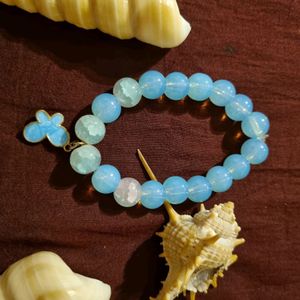 BLUE BEAD BRACELET WITH BUTTERFLY CHARM