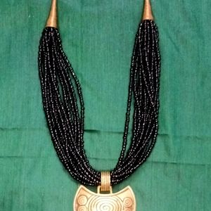 Black Beaded And Gold Brass Necklace.