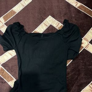 black fitted top with long sleeves