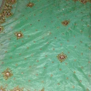 Net Saree With Blouse In Green Colour