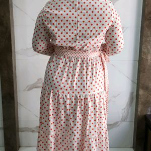 Three tiered orange polka print white dress