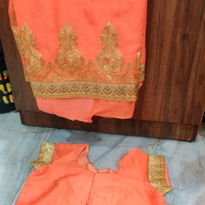 New Orange/Peach With Golden Work Saree