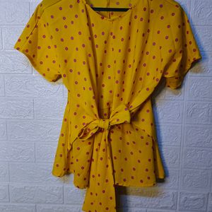 "Sunny Chic: Yellow Polka Dot Top with Tie-Up Bow"