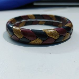 Red, gold, black braid bangle