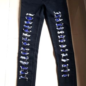 Black patterned skinny jeans