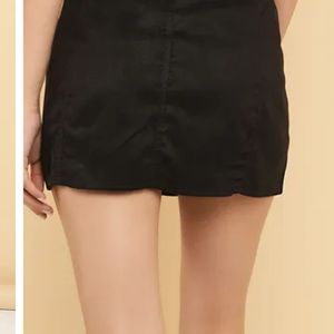 A line buttoned black skirt