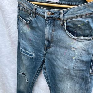 Zara ripped patches colour splash jeans