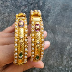 Gold Bangles Pair, And Plastic Bangle