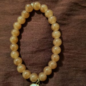 BROWN BEAD BRACELET WITH CHARM