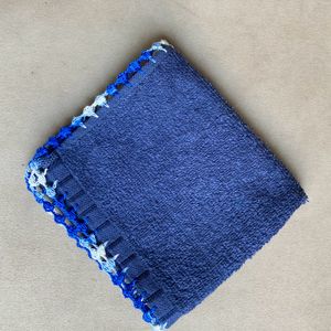 A Hand Napkin With Crochet Border