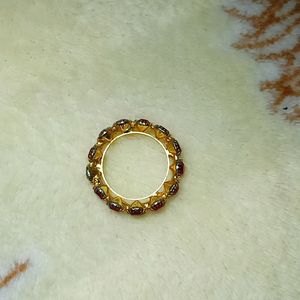 A Beautiful Golden Ring With Red Diamonds