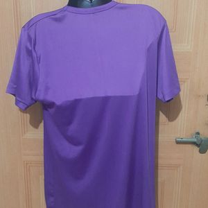 NIKE AIR PURPLE ACTIVE WEAR TSHIRT.