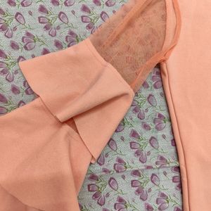 A Peach Trendy Top With Frills Sleeves