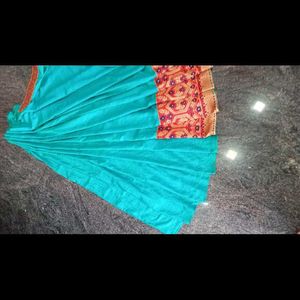 A Beautiful Sky Blue Saree With Red Flower Border