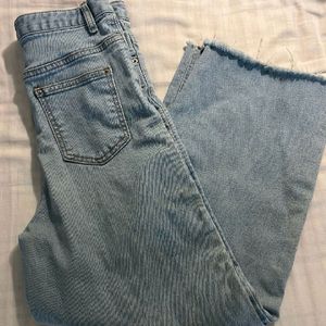 Ankle Length Jeans With Whiskered End.