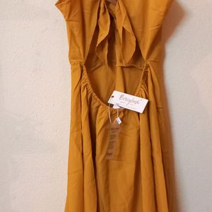 Today's Offer ₹150 Berrylush Women Solid Yellow Front Twist Knot Fit & Flare Mini Dress For Women (Mustard Colour)