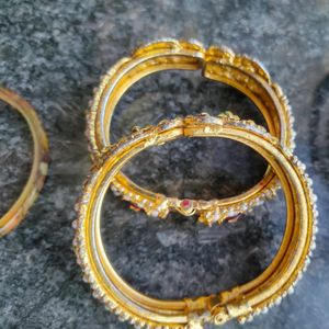 Gold Bangles Pair, And Plastic Bangle