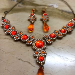 Elegant White And Orange Stone Studded Jewelry Set