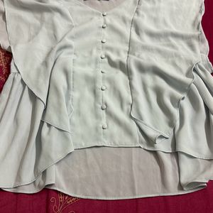 light blue frilled top