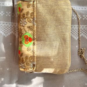 A Embroidered Sling Bag Golden In Color