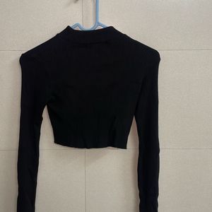 Cropped ribbed turtleneck top