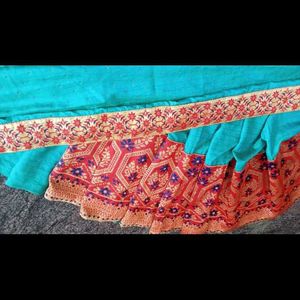 A Beautiful Sky Blue Saree With Red Flower Border