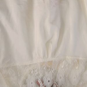 coquette off white sleeveless top