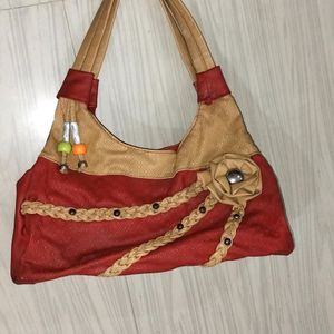 Beautiful Red Coloured Hand Bag In Good Condition