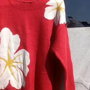 Red Sweatshirt With White Flowers