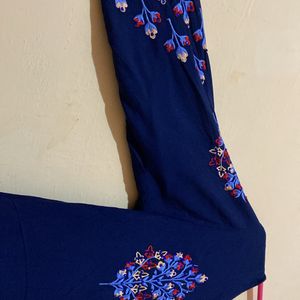 A Dark Blue Long Kurta , With Design On Shoulder.