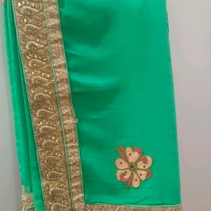 A Green Saree With Navy Blue Border