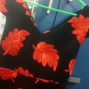 Black V Neck Gown With Red Leaves