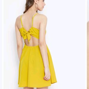 Today's Offer ₹150 Berrylush Women Solid Yellow Front Twist Knot Fit & Flare Mini Dress For Women (Mustard Colour)