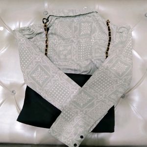 A pemplum sleeves top with chain blouse upon it