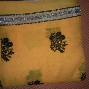 Elegant Yellow Saree With Beautiful Black And Silver Border