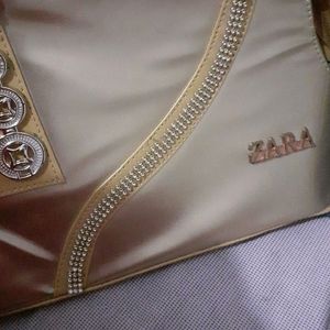 golden hand bag