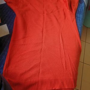 Orange Sweater With Black Print  . Lightly Lint On This