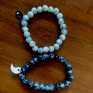 Black + White Beaded Bracelets With Charm.