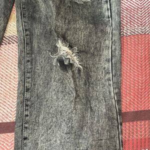 Acid washed distressed black oversized jeans