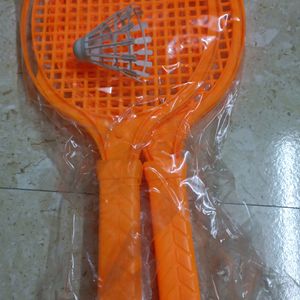 Two Toy Rackets And Shuttle Cock