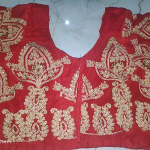 red blouse with golden stone work.